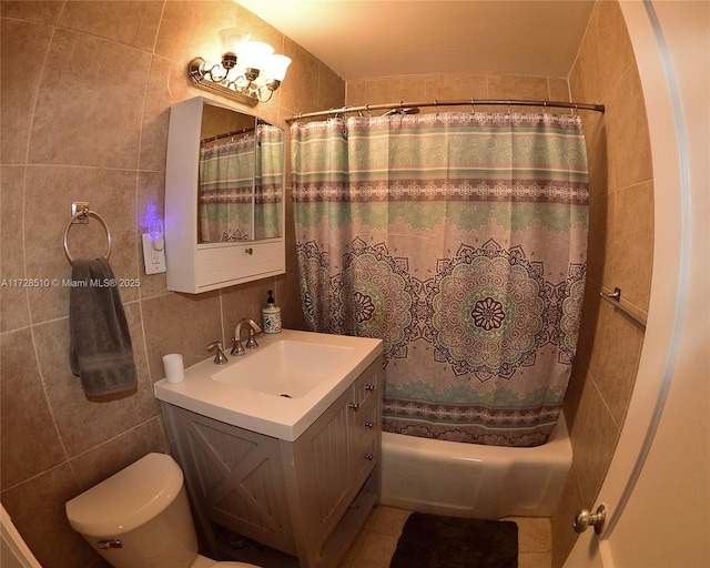 full bathroom featuring vanity, toilet, shower / bath combination with curtain, and tile walls