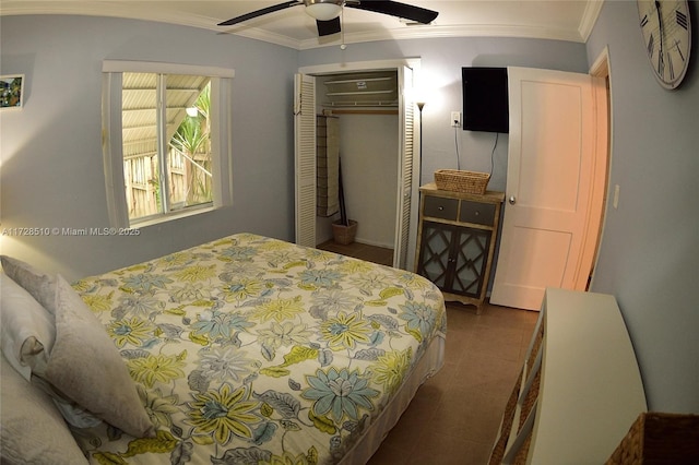 bedroom featuring ceiling fan, a closet, and crown molding