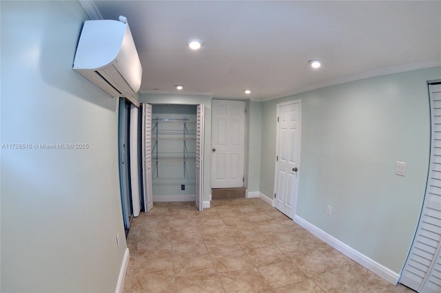 interior space featuring a wall unit AC and ornamental molding