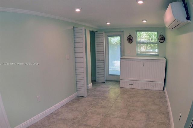 interior space featuring a wall mounted air conditioner and crown molding