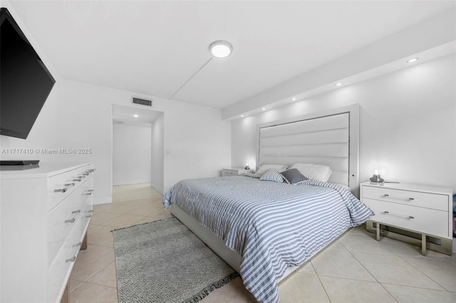 bedroom with light tile patterned flooring