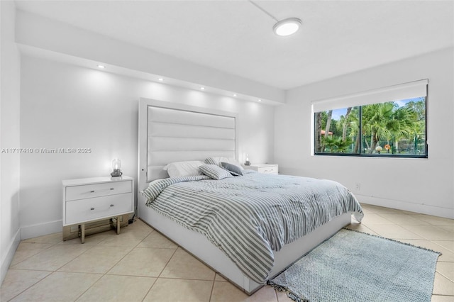 bedroom with light tile patterned floors