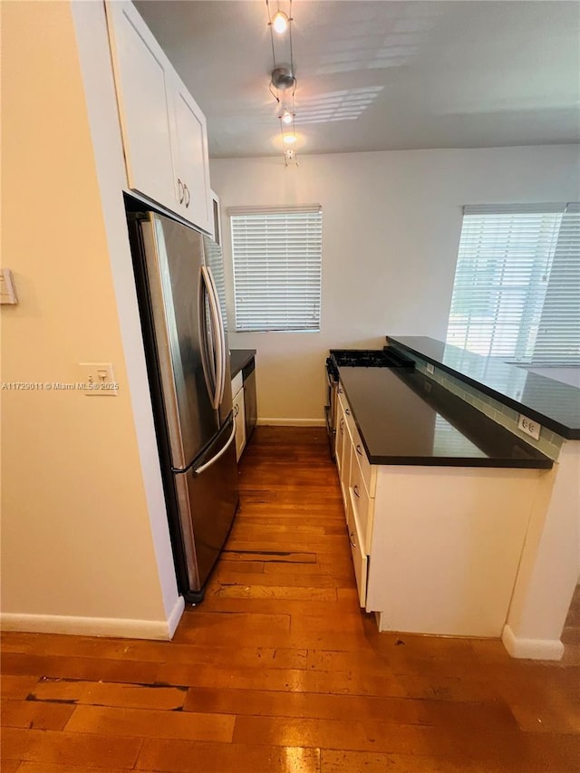 1523 W Ave Unit 101, Miami Beach, FL 33139 - kitchen with freestanding refrigerator, dark wood-style flooring, and baseboards