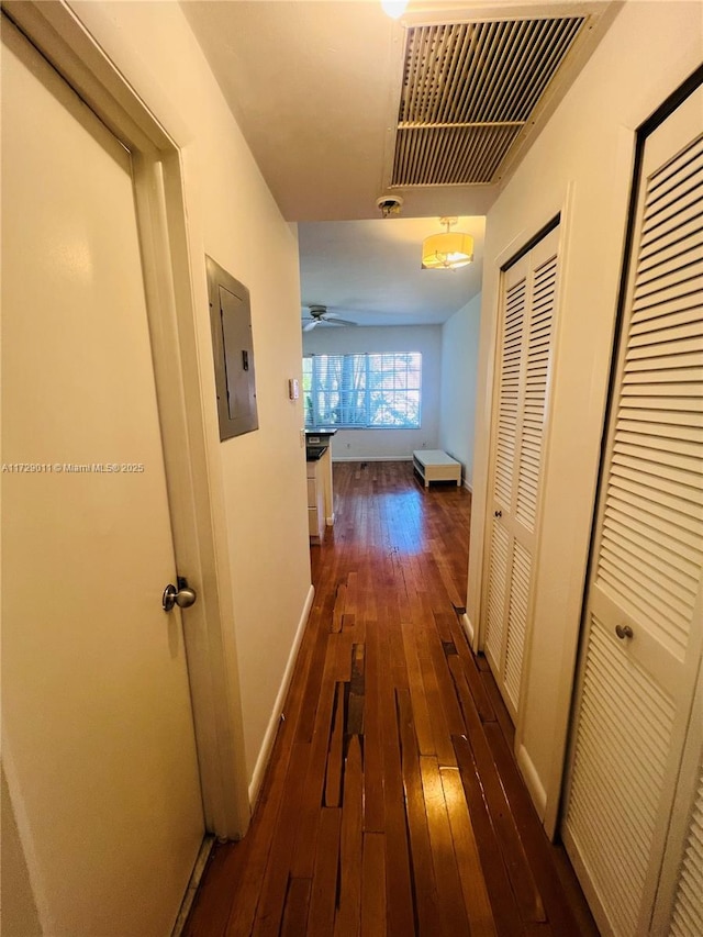 1523 W Ave Unit 101, Miami Beach, FL 33139 - hall featuring electric panel, dark wood finished floors, and baseboards