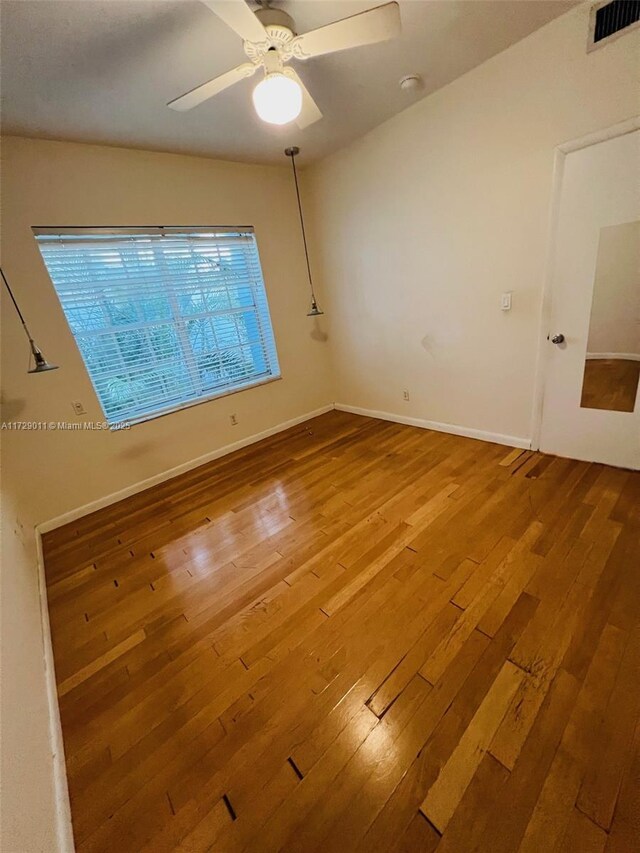 bedroom with light wood-type flooring, ceiling fan, and a closet