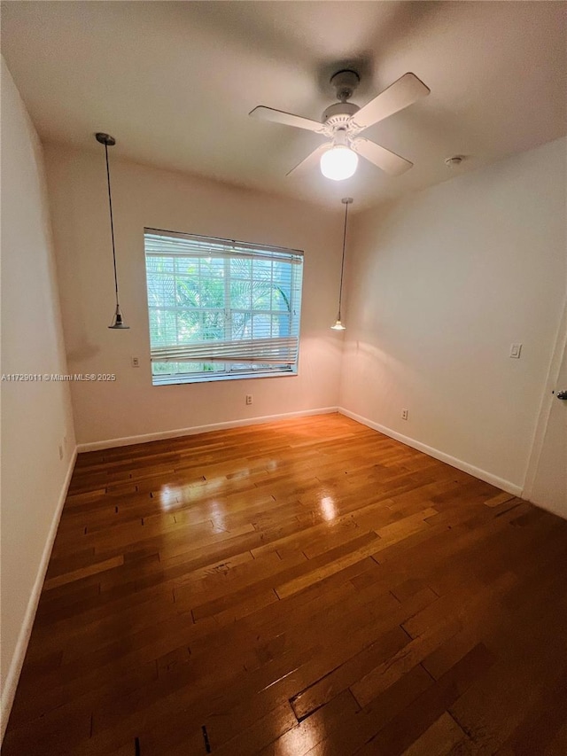 1523 W Ave Unit 101, Miami Beach, FL 33139 - unfurnished room with hardwood / wood-style flooring, baseboards, and a ceiling fan