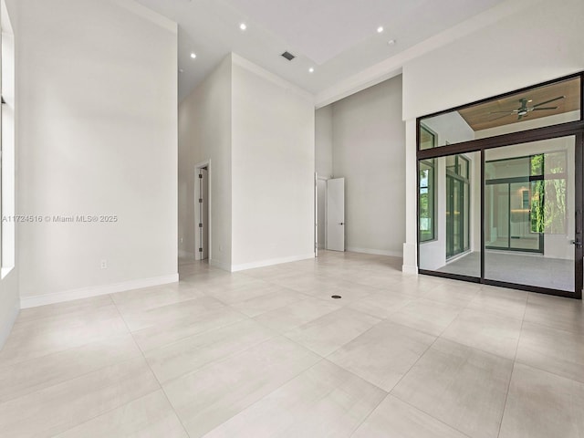 spare room with a towering ceiling