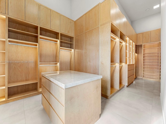 walk in closet featuring light tile patterned floors