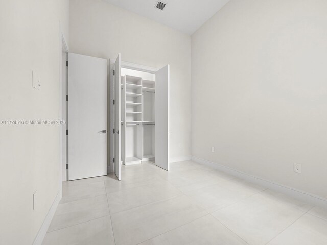 unfurnished bedroom with a closet