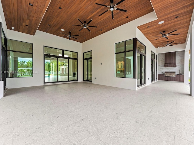 interior space featuring ceiling fan and area for grilling