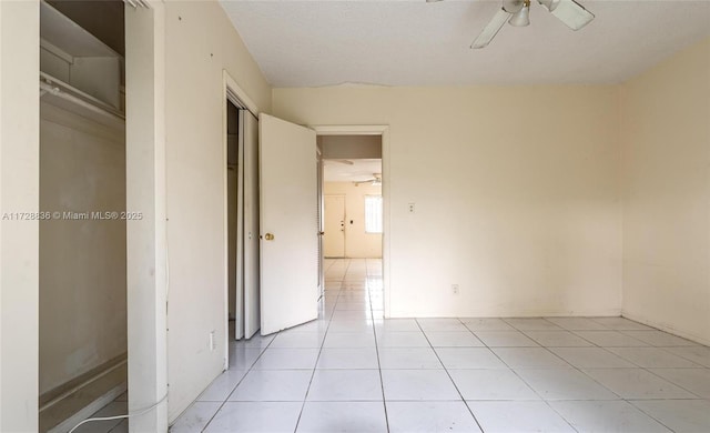 unfurnished bedroom featuring ceiling fan and light tile patterned flooring