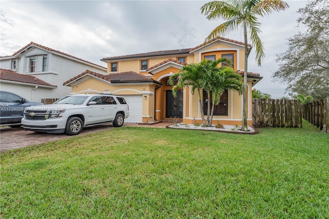 mediterranean / spanish-style house with a front yard