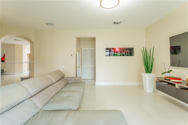 living room with light tile patterned flooring