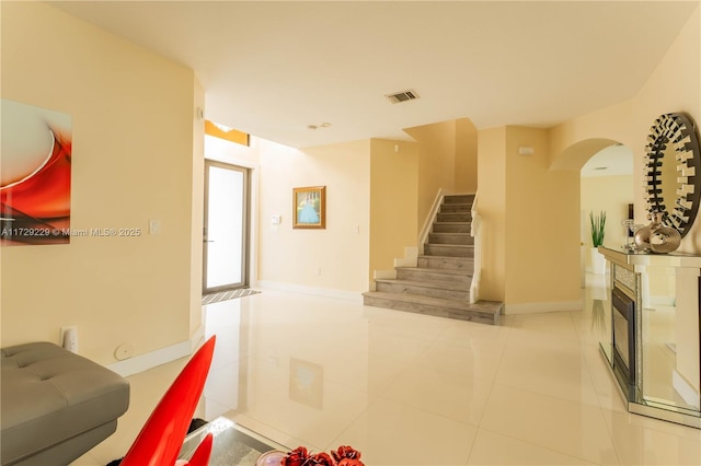 stairway featuring tile patterned flooring