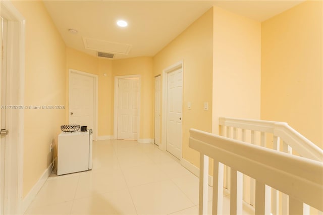 corridor with tile patterned flooring