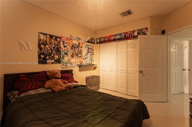 tiled bedroom featuring a closet