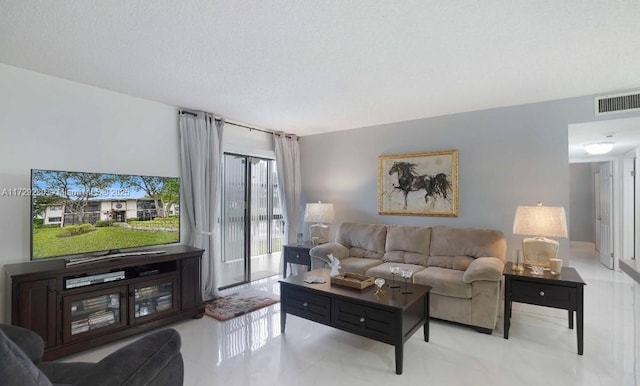 living room with a textured ceiling