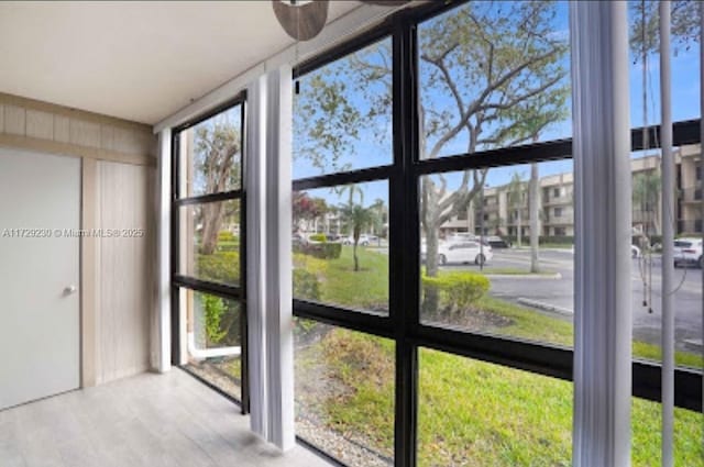 unfurnished sunroom with a wealth of natural light