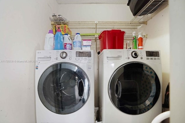 laundry room featuring washer and clothes dryer