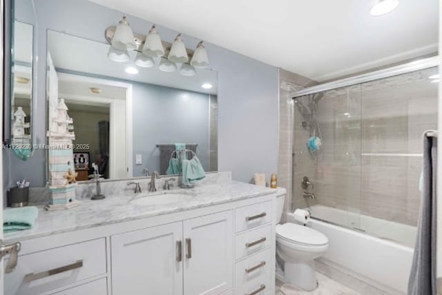 full bathroom featuring toilet, enclosed tub / shower combo, and vanity