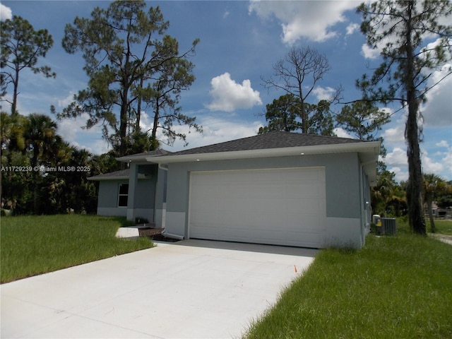 view of front of home with a garage, a front yard, and cooling unit