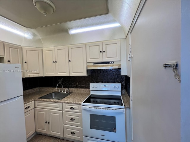 kitchen with sink, white cabinets, tasteful backsplash, and white appliances