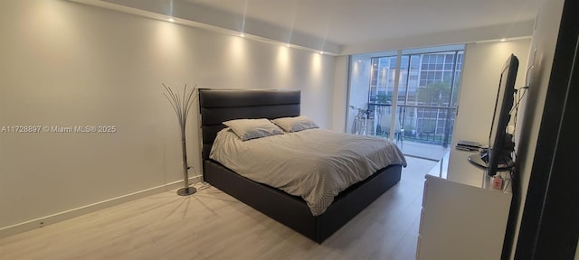 bedroom with hardwood / wood-style floors