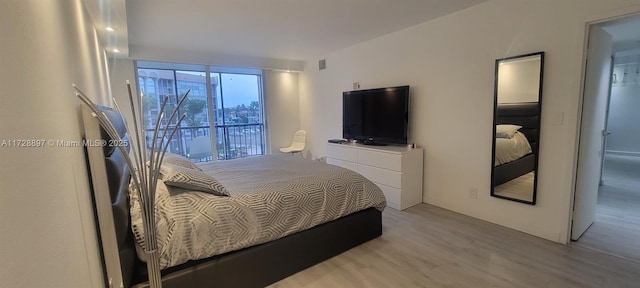 bedroom with light wood-type flooring