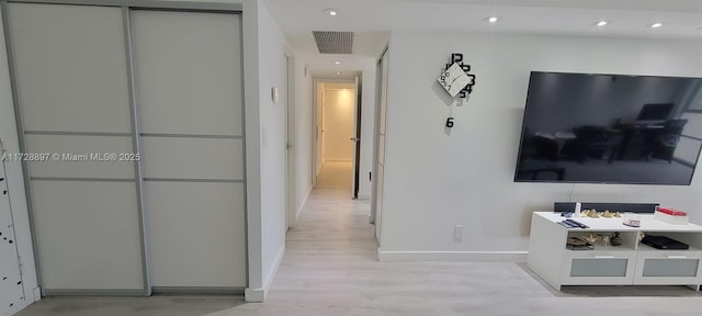 hallway featuring light hardwood / wood-style flooring