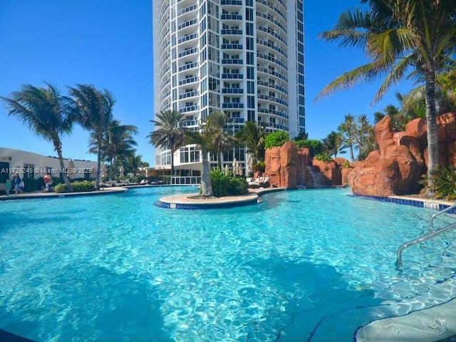 view of pool with pool water feature