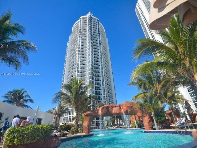 view of pool with pool water feature