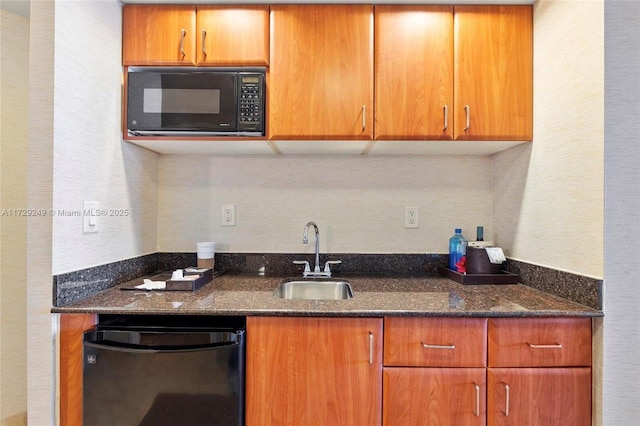 kitchen featuring black appliances, sink, and dark stone countertops