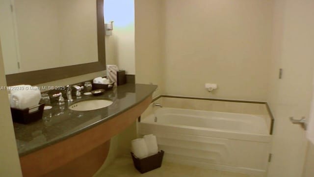 bathroom featuring vanity and a bathing tub