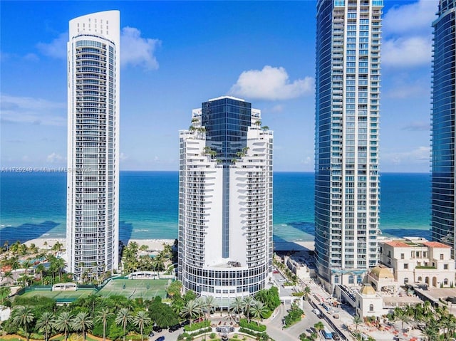 city view featuring a view of the beach and a water view