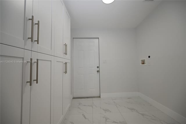 laundry area featuring washer hookup, electric dryer hookup, and cabinets