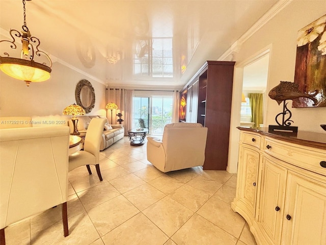 living room featuring light tile patterned floors, ornamental molding, and a towering ceiling