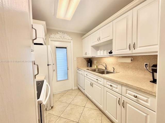 kitchen with light tile patterned floors, decorative backsplash, white appliances, white cabinets, and sink