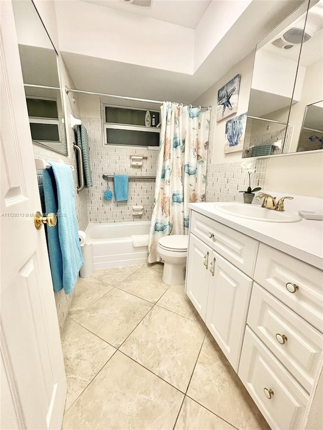 full bathroom with toilet, shower / bath combo, backsplash, tile patterned floors, and vanity