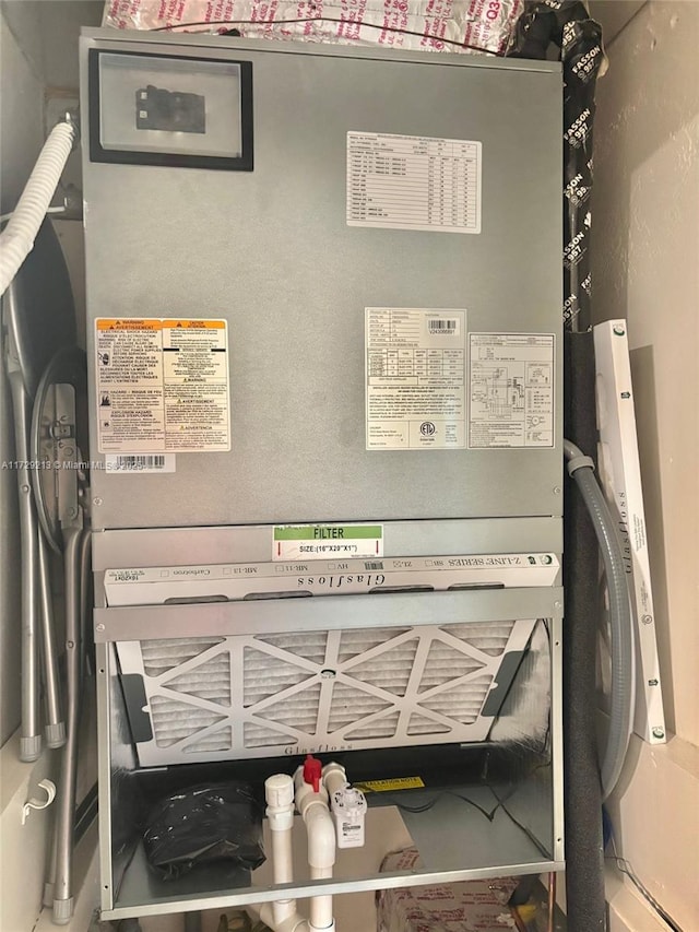 utility room with heating unit