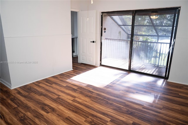 empty room with dark hardwood / wood-style floors