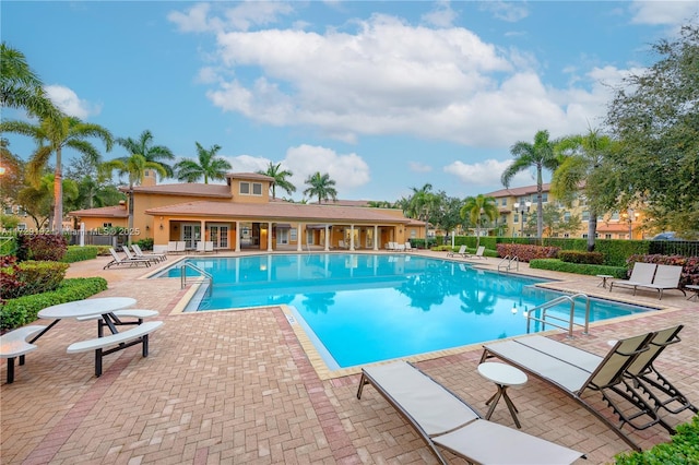 view of swimming pool featuring a patio area