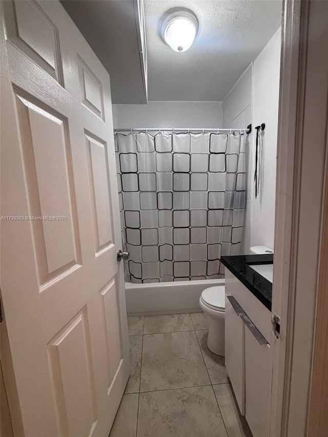 full bathroom featuring toilet, a textured ceiling, shower / bathtub combination with curtain, and vanity