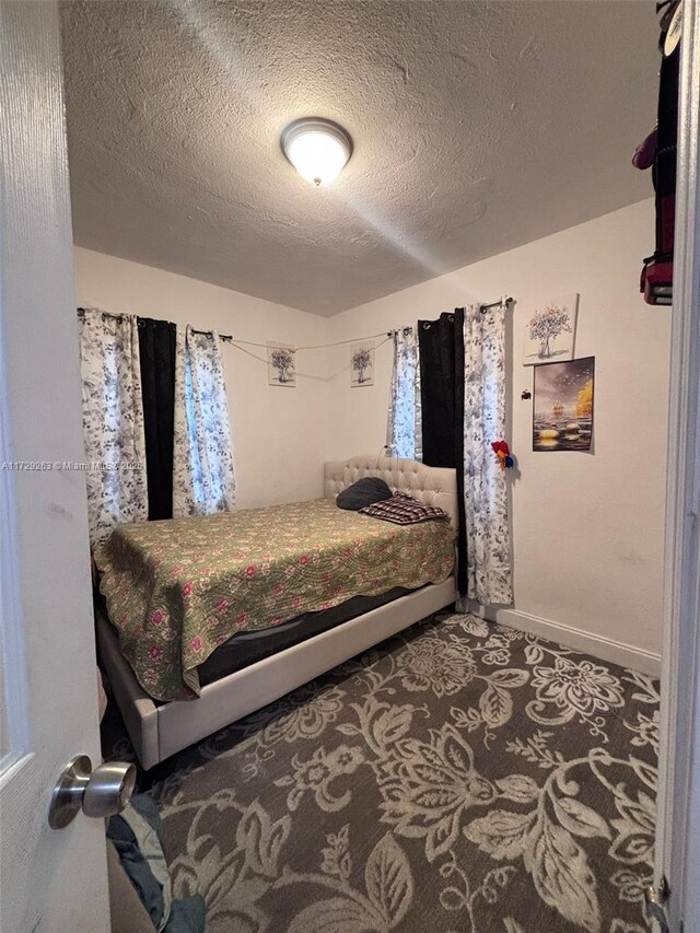 bedroom featuring a textured ceiling