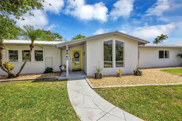 ranch-style home with a front yard