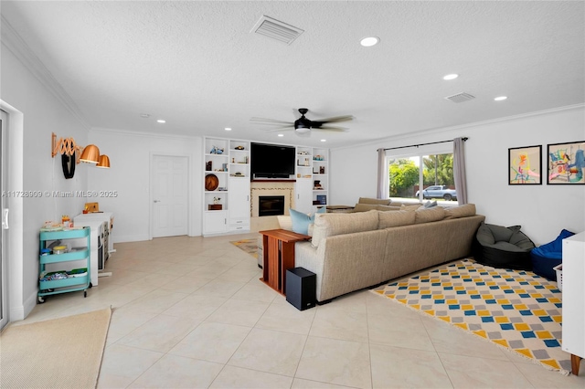 tiled living room with a textured ceiling, ceiling fan, crown molding, and built in features