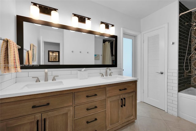 bathroom featuring tile patterned floors, vanity, and shower / bath combo with shower curtain