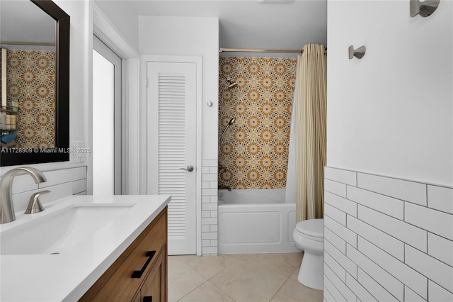 full bathroom featuring toilet, vanity, tile patterned floors, and shower with separate bathtub