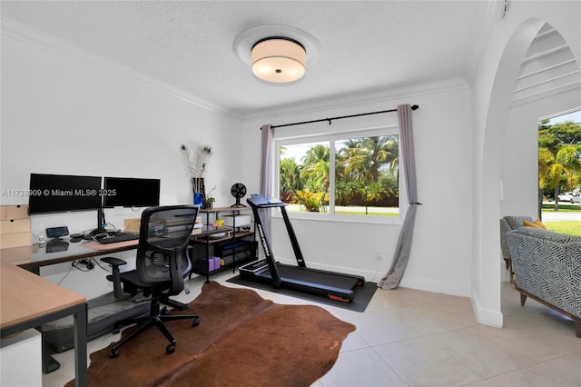 office area with a textured ceiling, light tile patterned floors, and crown molding