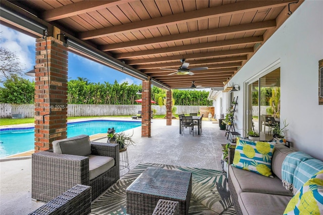 view of patio featuring an outdoor hangout area, ceiling fan, and a fenced in pool