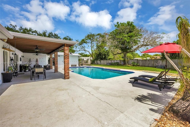 view of pool with ceiling fan and a patio